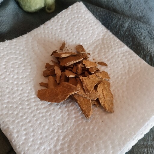 Pile of brownish-oranges shards of rock on a white paper towel.
