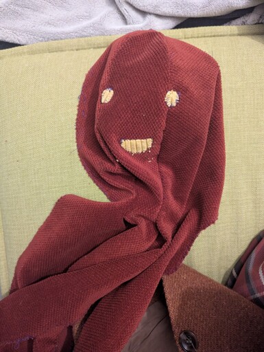 One half of an octopus plushie. It has a face made from some old fabric scraps.